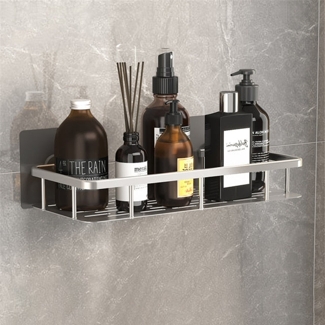 Minimalist black metal suction shower caddy, a sleek solution for bath product storage.