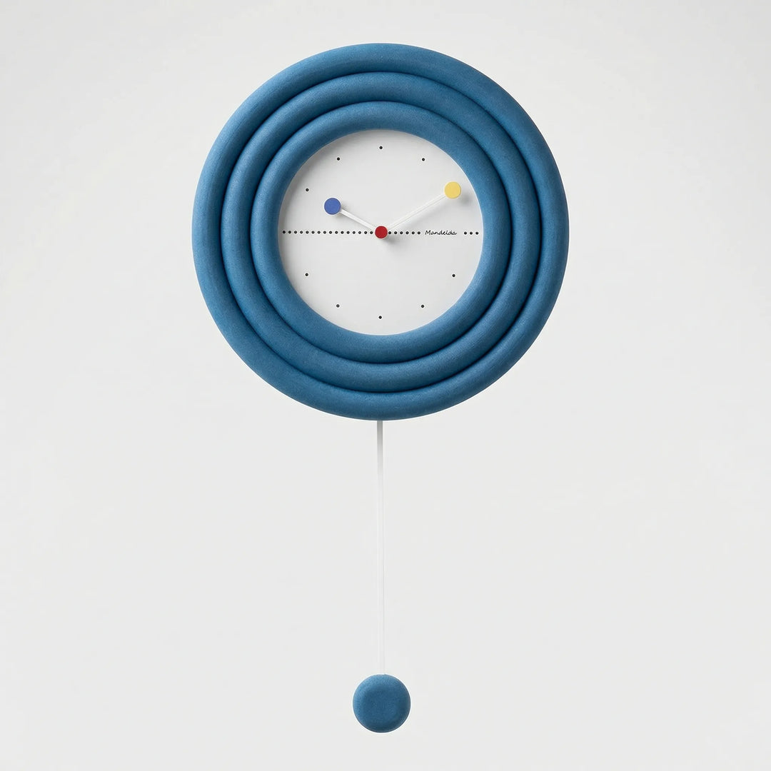 Decorative minimalist pendulum wall clock, a round accent piece for any modern home interior.