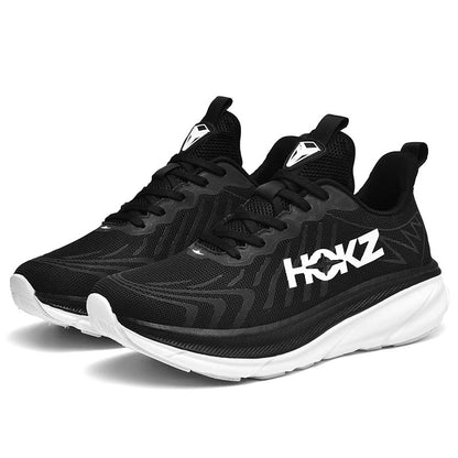 "Sneakers unisex con tecnologia SpringTech, design moderno nero, suola a molla visibile, ideali per sport e attività quotidia