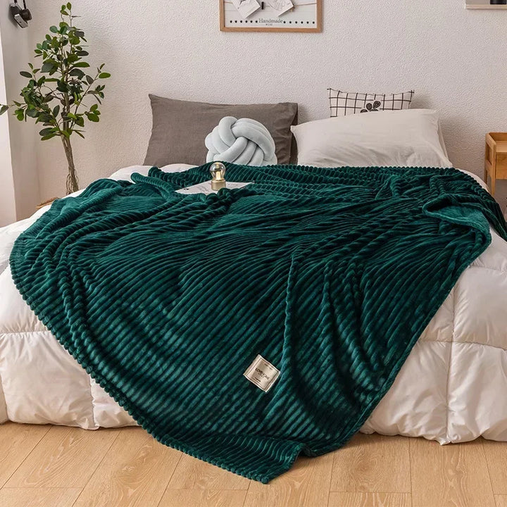 Plush, soft flannel blanket in a solid color, perfect for adding cozy warmth to any living room or bedroom.