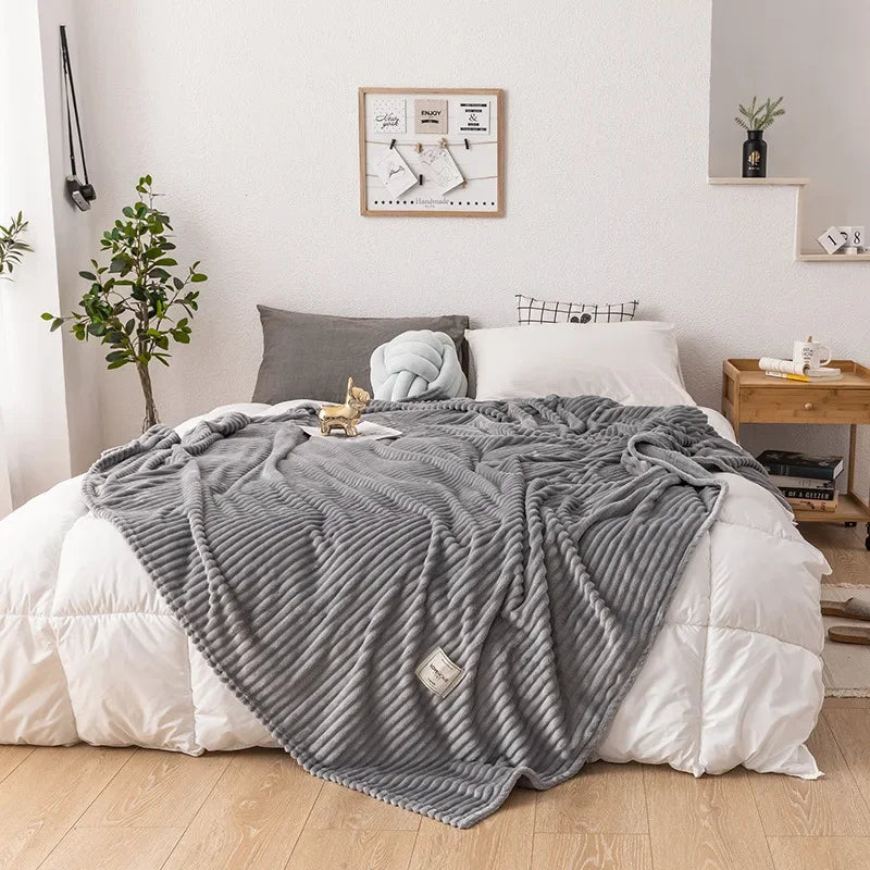 Gift-ready cozy flannel blanket, a soft and warm home decor textile for autumn comfort and winter snuggles.