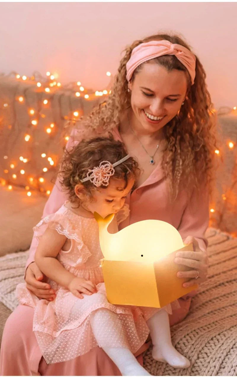 Cute color-changing whale night light, an ideal baby gift for nurseries, with soft LED glow & touch control.