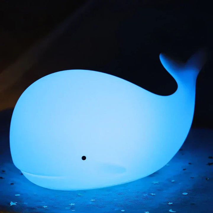Kids' color-changing whale night light, a silicone LED lamp with touch sensor, great for a soothing nursery.