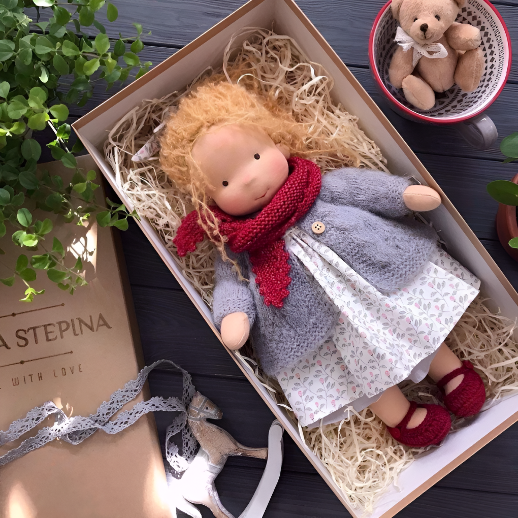 Plush Waldorf doll, a cuddly children's toy, handmade from natural materials for imaginative fun.