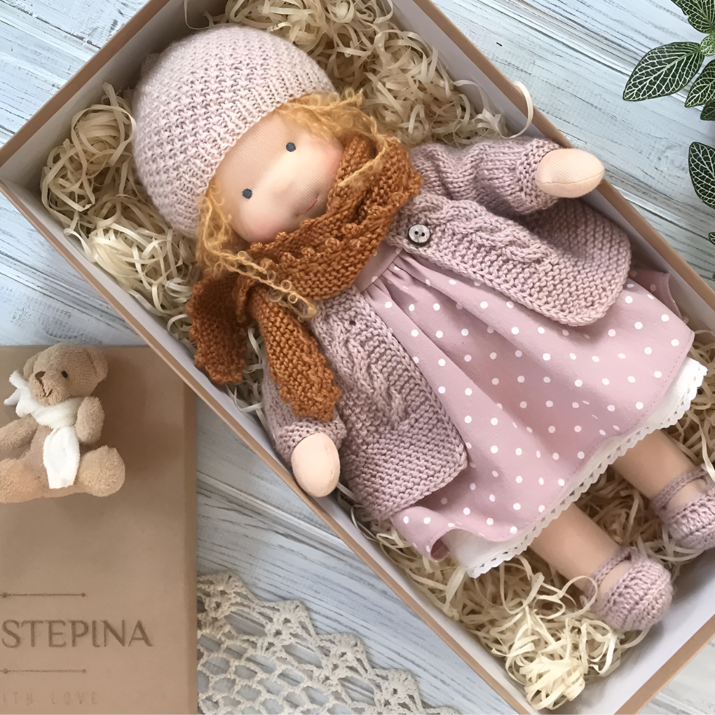 Waldorf doll, a gentle and soft cuddly toy from natural materials for imaginative play.