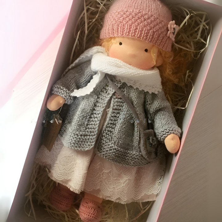 Imaginative play Waldorf doll, a soft, handmade, cuddly toy for children.