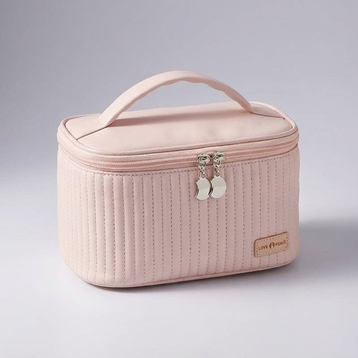 Stylish quilted travel cosmetic bag, a compact makeup organizer for all your journey essentials and toiletries.