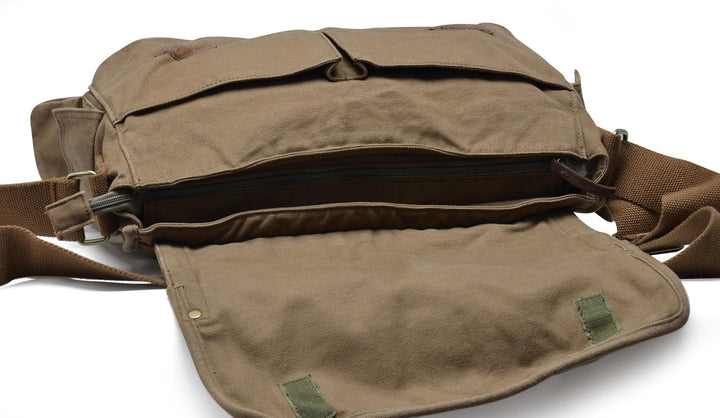 Versatile vintage canvas messenger bag worn as a comfortable shoulder or crossbody bag for unisex use.