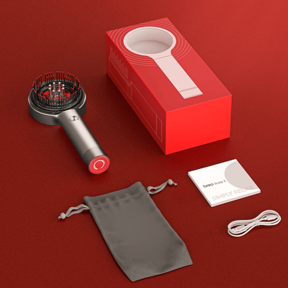 "Spazzola massaggiante per cuoio capelluto con luce rossa, design ergonomico, ideale per stimolare la crescita dei capelli."