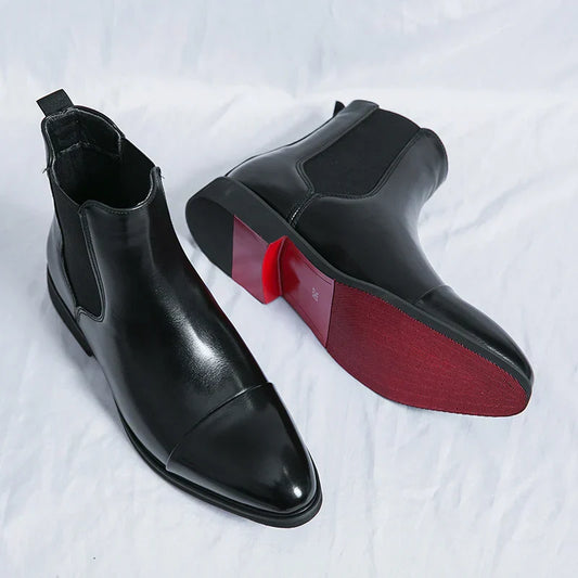 "Stivaletti Chelsea in pelle nera con dettagli elastici, design elegante e moderno per un look maschile sofisticato."