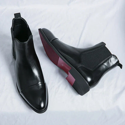 "Stivaletti Chelsea in pelle nera con dettagli elastici, design elegante e moderno per un look maschile sofisticato."
