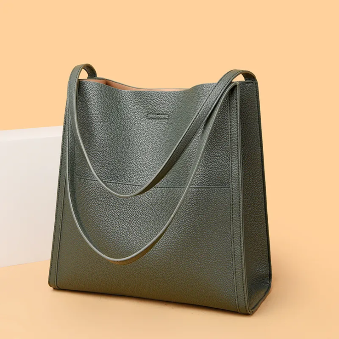 Large brown leather women's shoulder bag, stylish and durable with ample space.