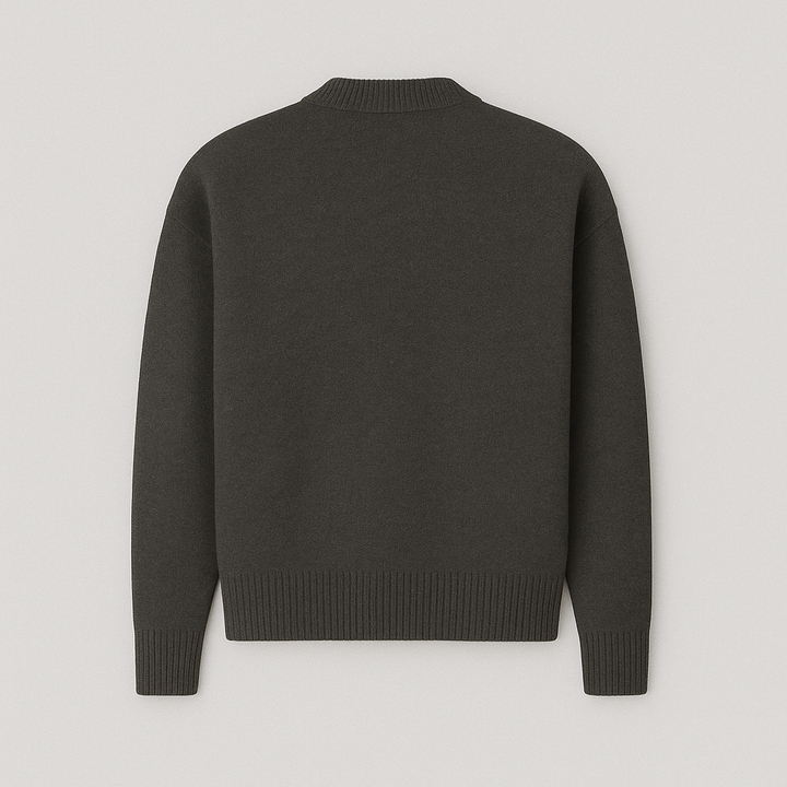 Modern men's fashion: An oversized crew neck sweater with a distinct heart motif, offering stylish comfort.