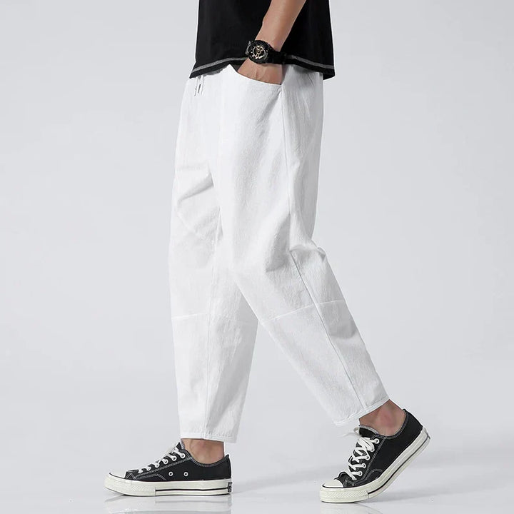 Modern men's tapered cropped pants, ideal for stylish casual summer wear. Easy fit and comfortable men's fashion.
