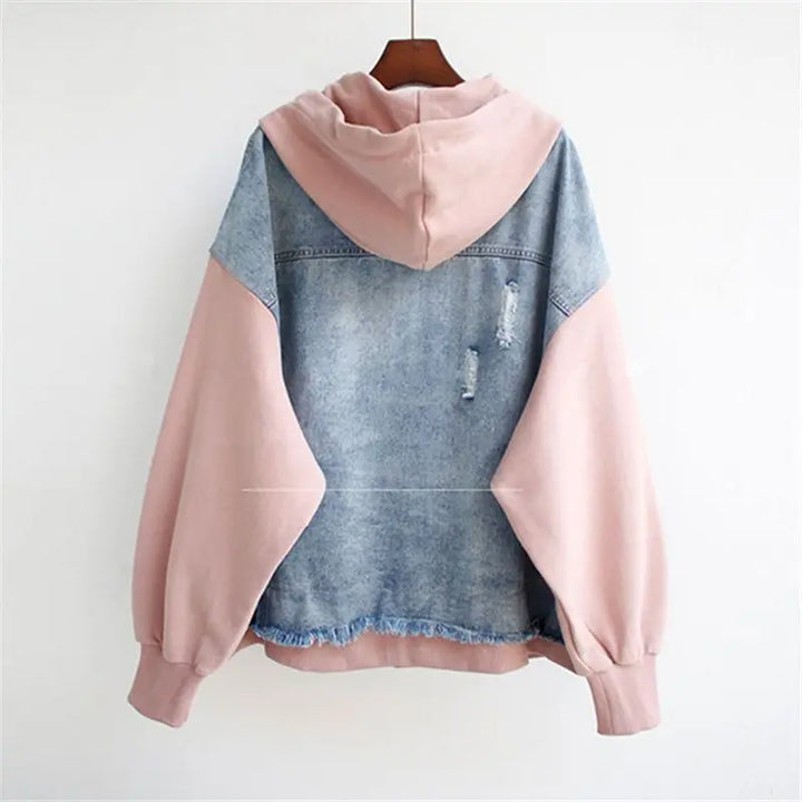 Modern white women's two-piece outfit with a fashionable hoodie and comfortable matching bottoms.