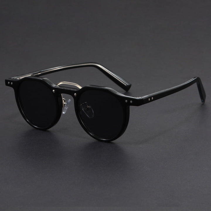 Modern unisex UV400 sunglasses with sleek black frames and dark lenses, essential fashion accessory.