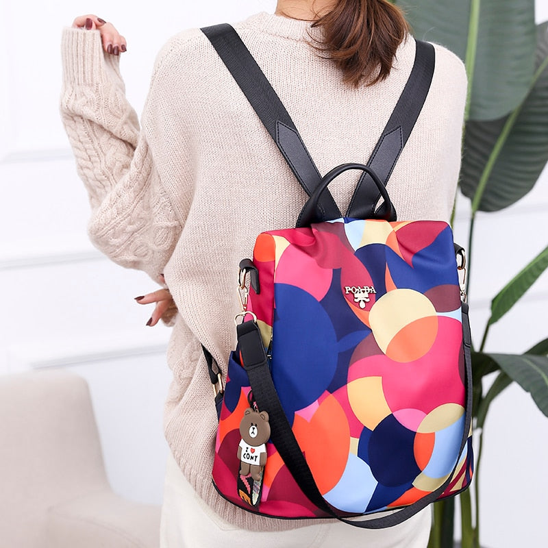 Stylish women's anti-theft backpack in PU leather, water-resistant with secure multi-pocket design for daily travel.