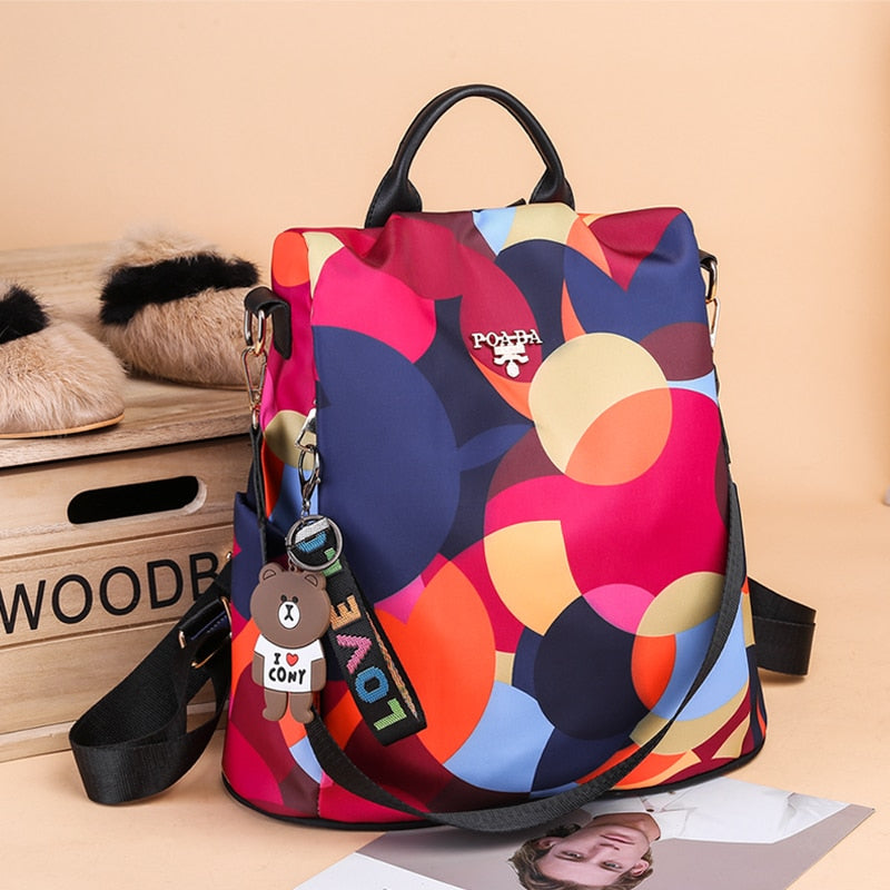 Daily use women's anti-theft backpack, water-resistant & stylish, with multiple pockets for secure storage.