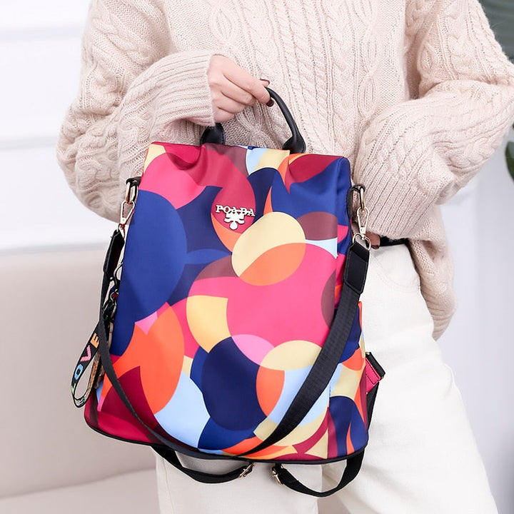 Back view of a secure anti-theft women's backpack, water-resistant with hidden zipper for ultimate safety.