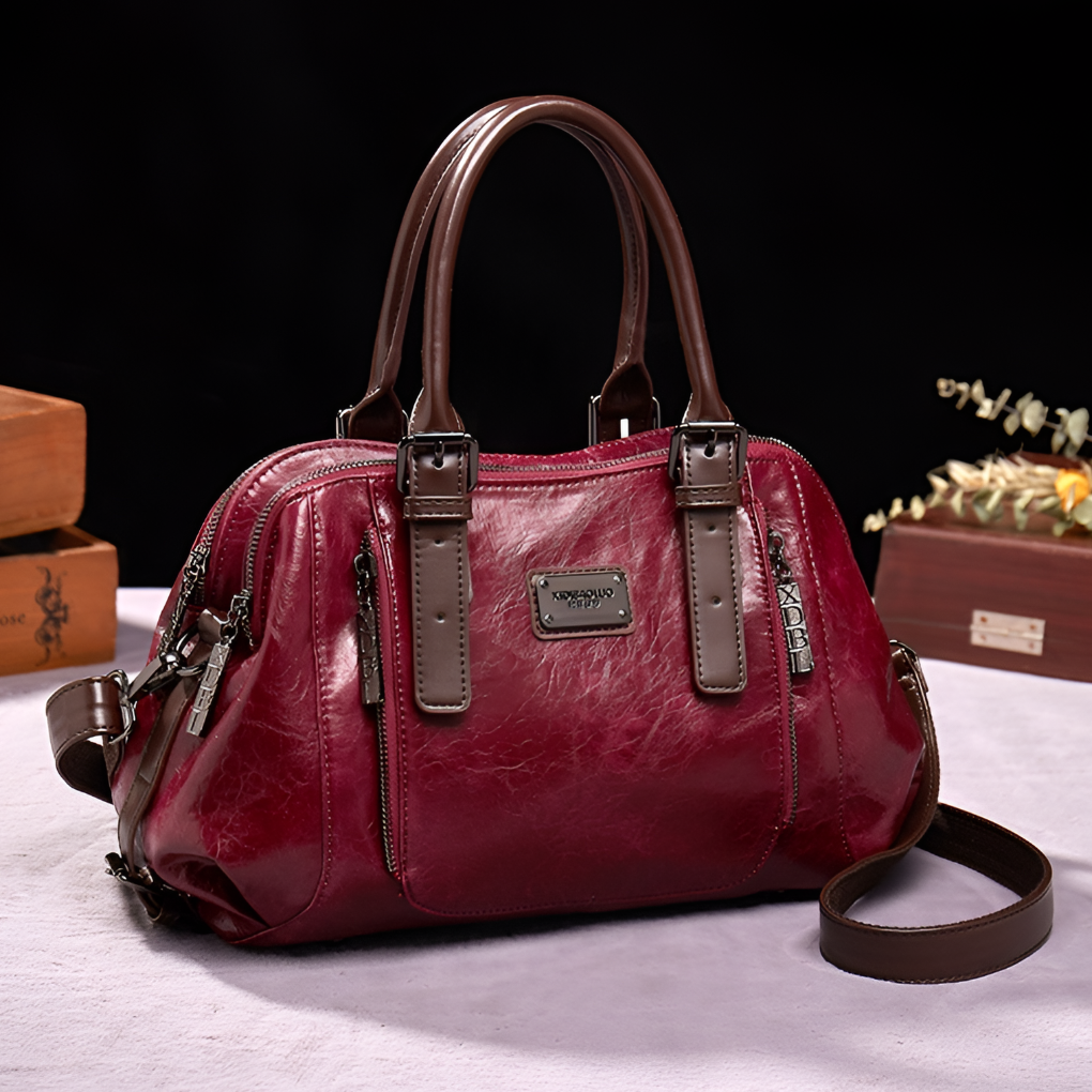 Elegant women's Boston handbag featuring a luxurious croc embossed texture, perfect for a sophisticated look.