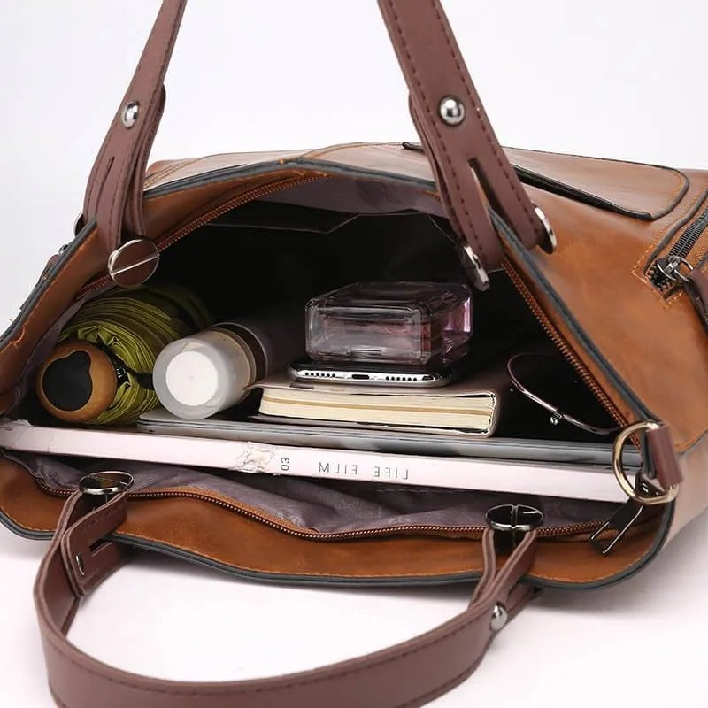Fashionable women's leather handbag with multiple pockets, a durable and organized tote purse.