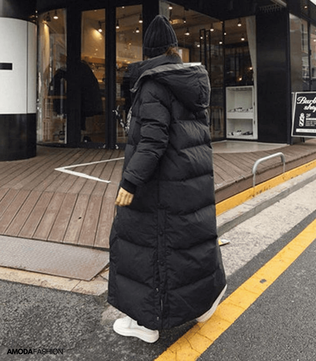 Close-up of a women's Luna oversized winter parka, showcasing waterproof fabric and warm, cozy design.