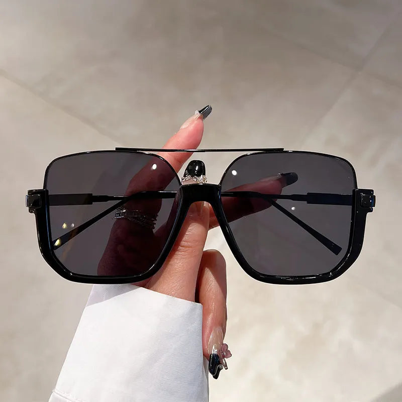 Oversized square frame UV400 sunglasses for women. Provides stylish eye protection & a chic look.