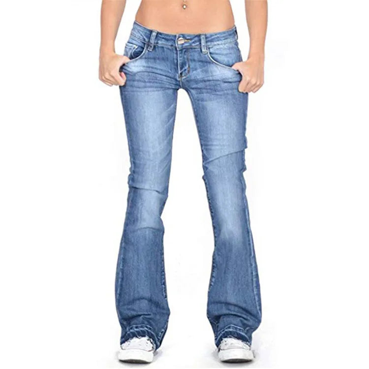 Neatly folded women's vintage low-rise flared jeans, showcasing their classic cut & readiness for stylish wear.