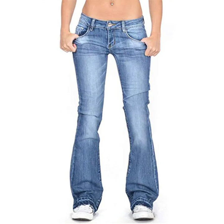 Neatly folded women's vintage low-rise flared jeans, showcasing their classic cut & readiness for stylish wear.