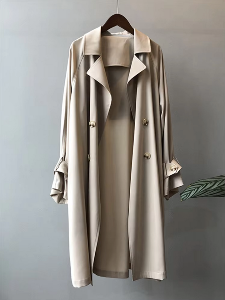 Women's waterproof double-breasted trench coat. Ideal stylish outerwear for fall and spring fashion.