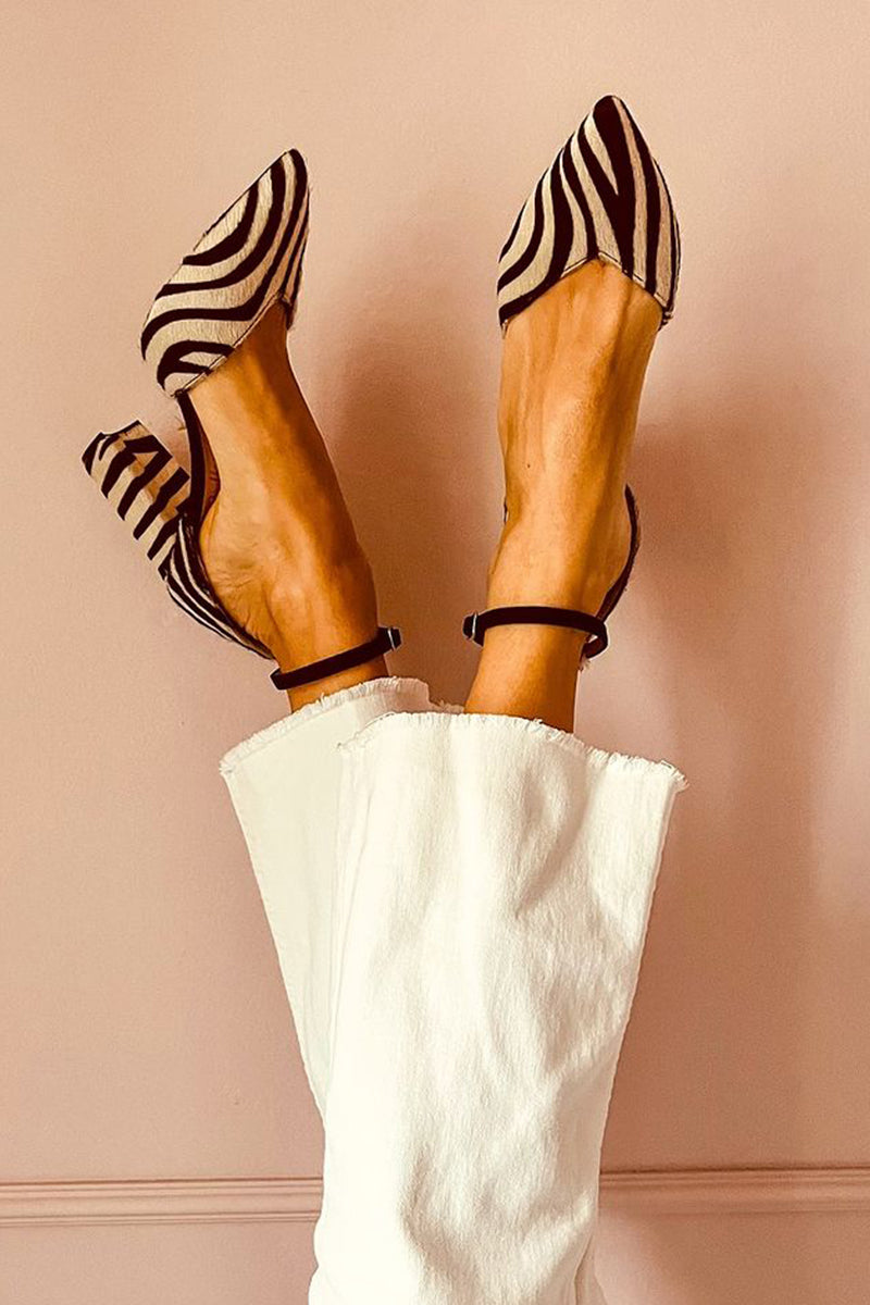 Stylish women's zebra print block heel sandals with an ankle strap, perfect for summer fashion.