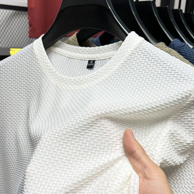 "T-shirt aderente uomo, colore neutro, vestibilità slim, ideale per ogni occasione, tessuto traspirante e confortevole."