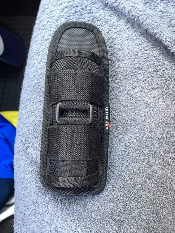 Versatile black flashlight holster for tactical operations, camping, and outdoor adventures
