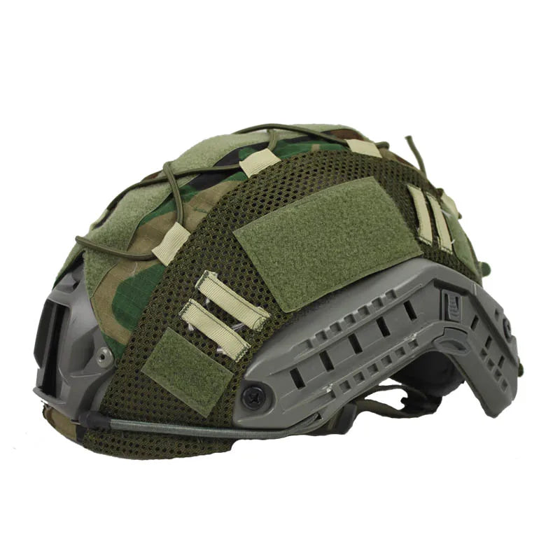 Tactical helmet cover with loop panels for patches, fitting FAST helmets, used in airsoft and tactical scenarios