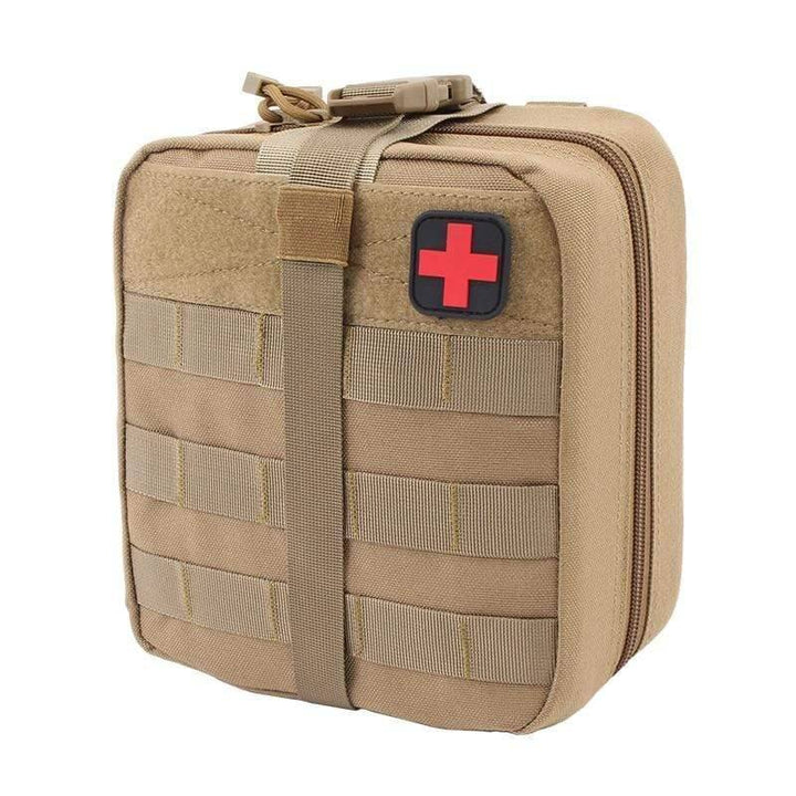 Water-resistant tactical first aid bag, closed with prominent red cross patch, essential for outdoor use.