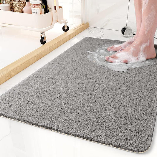 "Tappetino doccia antiscivolo Aqualuxe grigio, superficie luffa, sistema drenaggio igienico, comfort spa per ogni doccia."