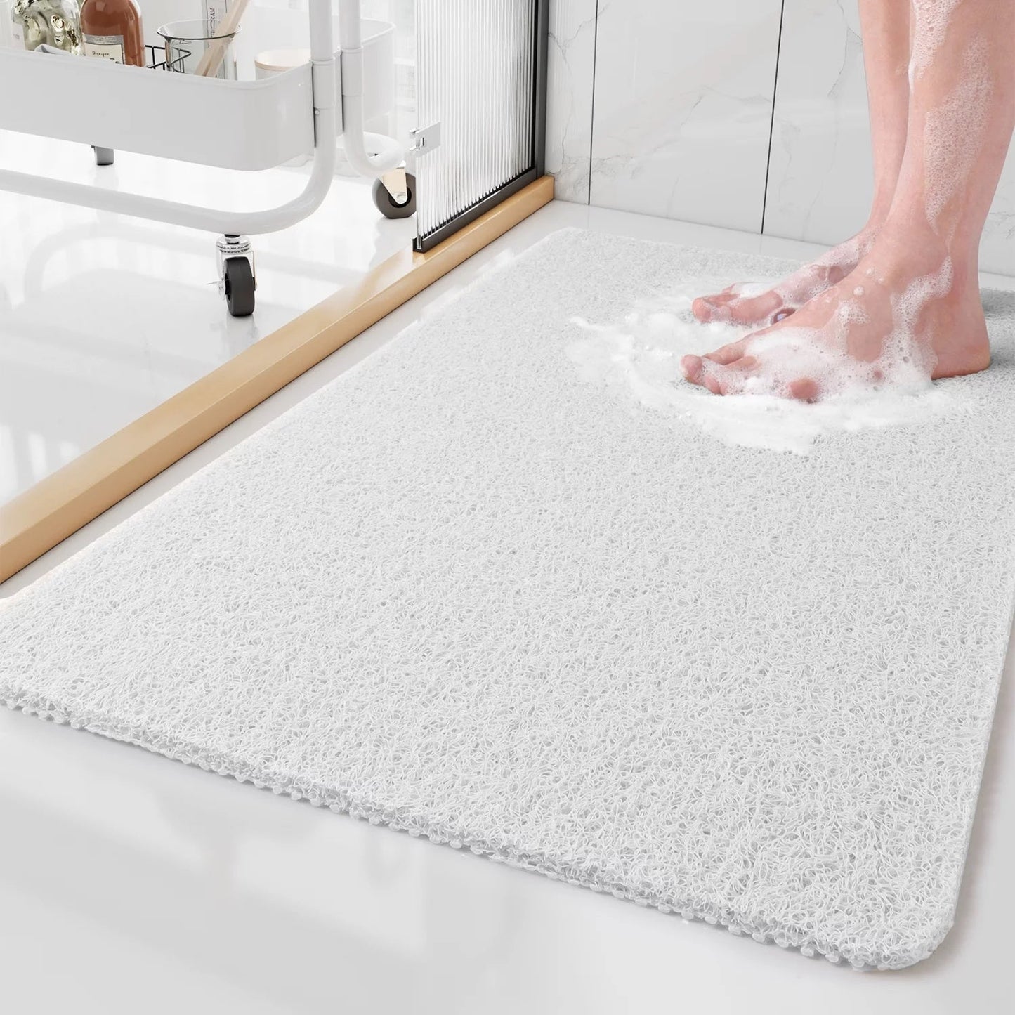 "Tappetino doccia antiscivolo Aqualuxe grigio, superficie luffa, sistema drenaggio igienico, comfort spa per ogni doccia."