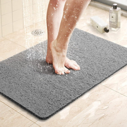 "Tappetino doccia antiscivolo Aqualuxe grigio, superficie luffa, sistema drenaggio igienico, comfort spa per ogni doccia."