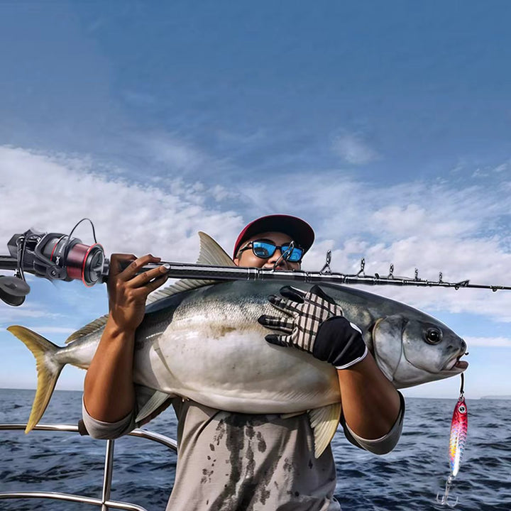 Angler successfully catching a fish with a telescopic carbon fiber spinning rod, demonstrating its effectiveness