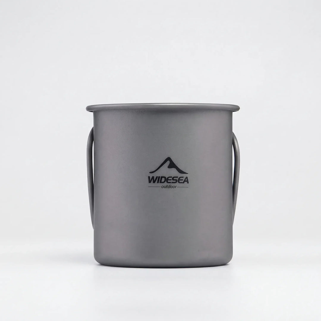 Portable travel mug made of titanium, featuring a foldable handle; ideal for hiking and camping.