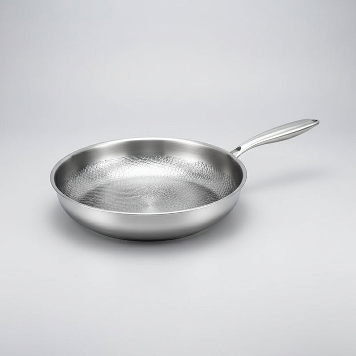 Elegant hammered titanium non-stick frying pan, induction ready, adds style and function to any kitchen.