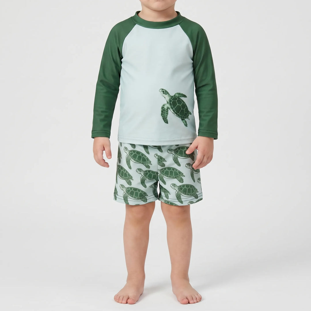 Long-sleeve toddler girl's swim set with playful tortoise print, offering excellent UV sun protection.
