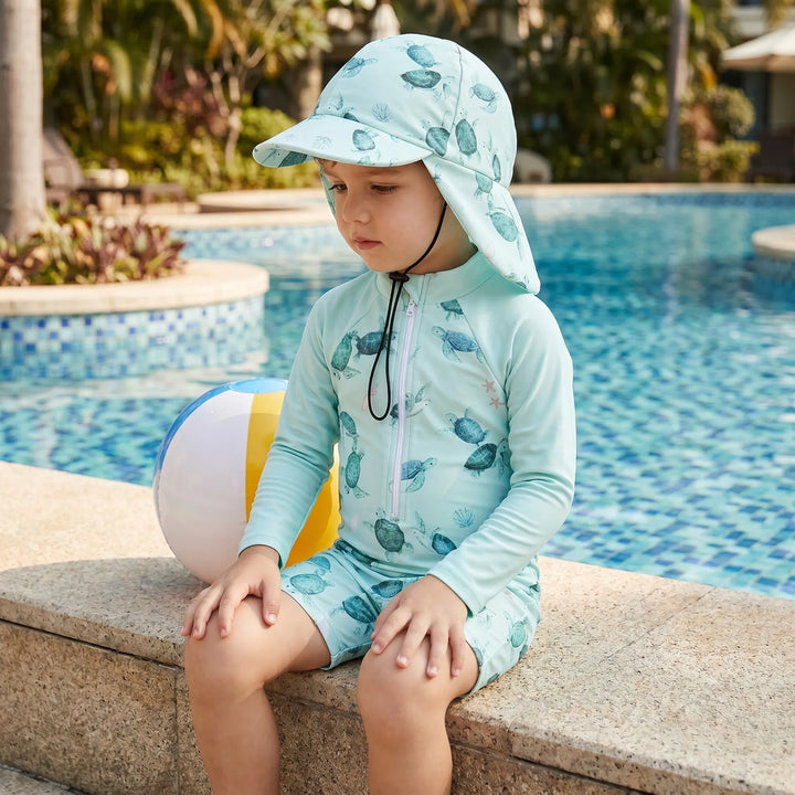 Toddler long-sleeve swimsuit set with matching sun hat for ultimate baby sun protection at the beach & pool.
