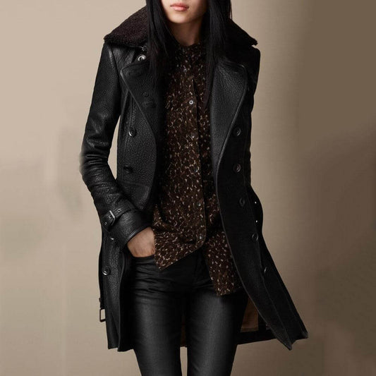 "Trench donna in pelle nero, stile classico, dettagli raffinati, valorizza silhouette, versatile per ogni occasione, adatto a