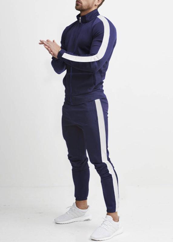 "Tuta da uomo in pile grigio, elasticizzata, con dettagli rinforzati, per stile casual e comfort in ogni stagione."