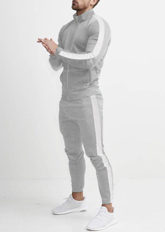 "Tuta da uomo in pile grigio, elasticizzata, con dettagli rinforzati, per stile casual e comfort in ogni stagione."