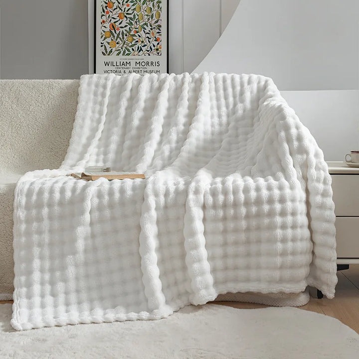 Stylish bubble flannel throw blanket, adding a soft, cozy touch to your living room or bedroom decor.