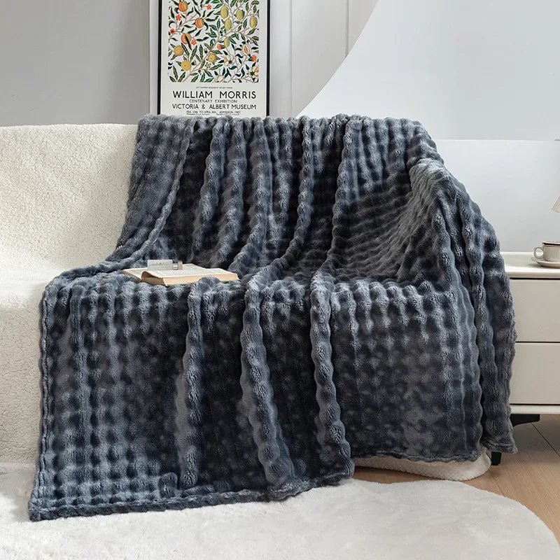 Close-up of the ultra soft bubble flannel texture on a comfortable throw blanket, enhancing home decor.