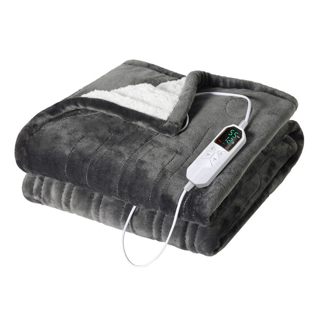 Electric heated blanket, spread out, showcasing its size and plush material for a snug warmth solution