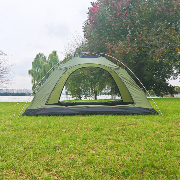 Army green ultralight 2-person tent packed in its carry bag, showing compact size for travel and backpacking.